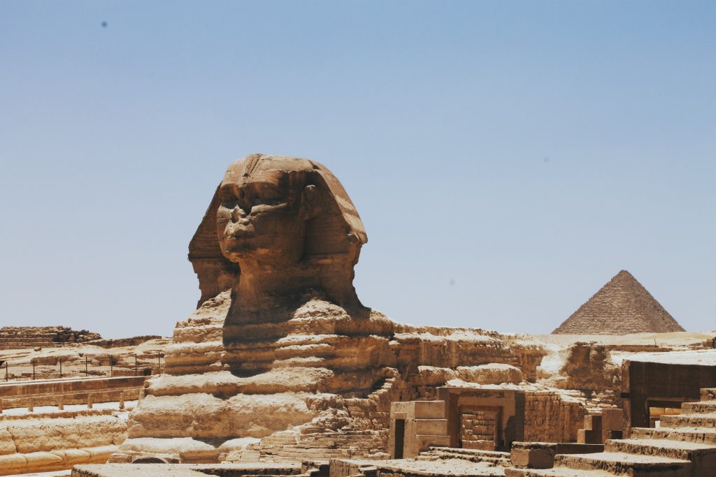 The View of the Great Sphinx of Giza and the Pyramid, the iconic Egyptian landmarks in the daylight.